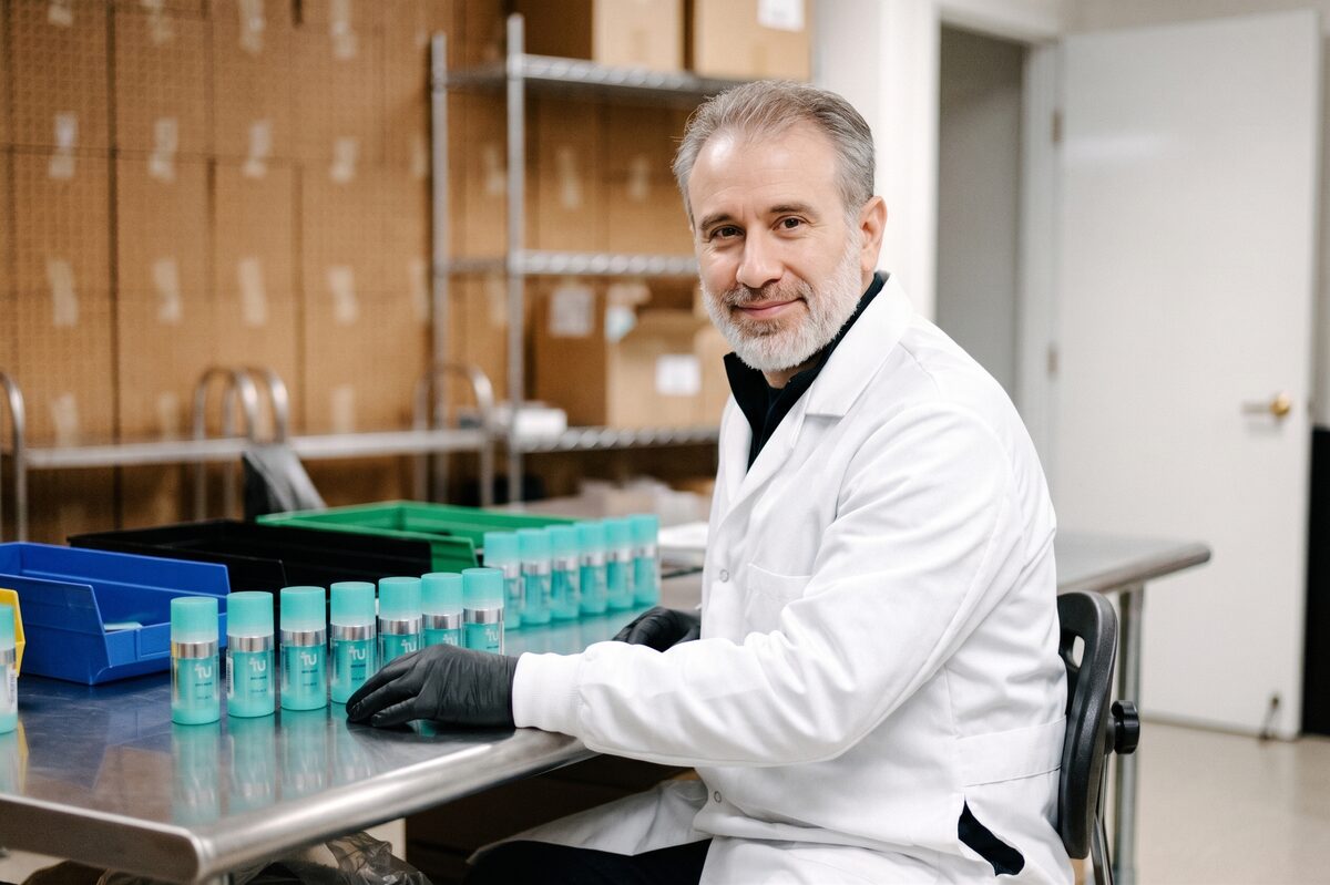 Kyle, Doctor of Pharmacy, at the lab bench